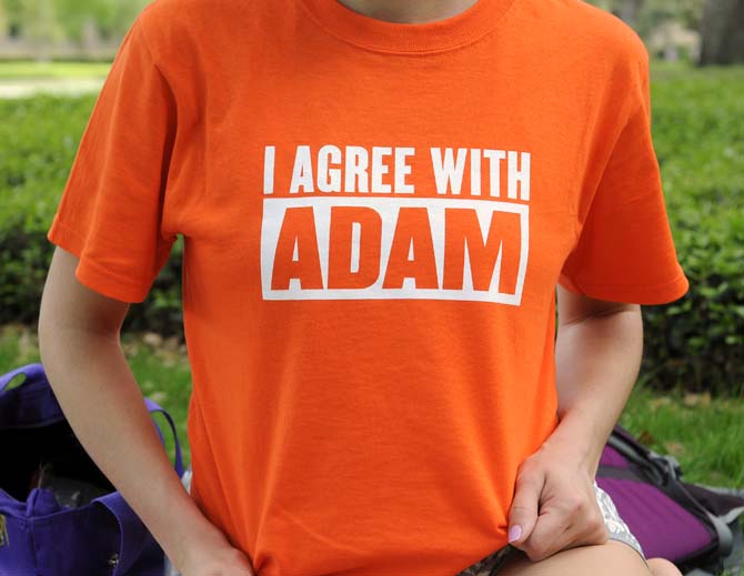 A student wears a shirt reading "I Agree With Adam," as part of a Christianity awareness campaign going on around campus.