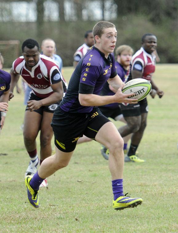 LSU eight man Will Middleton (8) tries to break through Mississippi State defenders Saturday, Feb. 22, 2014 during the Tigers' 75-5 win against the Bulldogs at Highland Road Community Park.