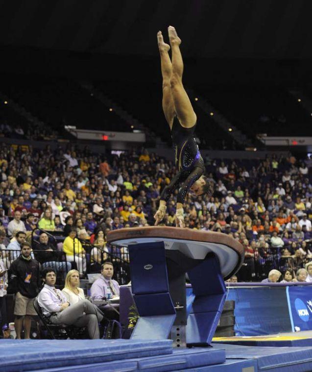 LSU freshman all-around Ashleigh Gnat flips over the vault Saturday, April 5, 2014, during the NCAA Gymnastics Regional in the PMAC. The Tigers won the meet with a school-record score of 198.325.