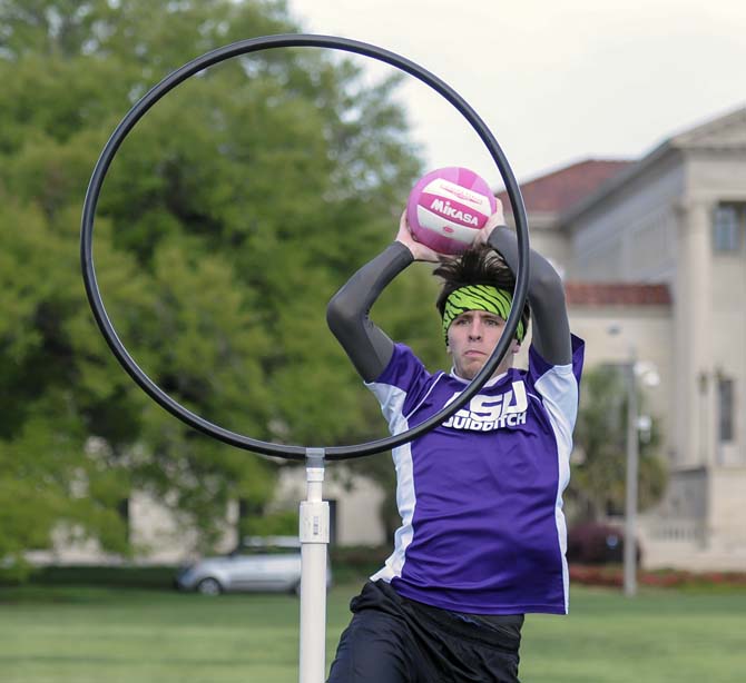 History sophomore Chis Rank throws the quaffle through the goal Tuesday, April 8, 2014, on the Parade Ground. LSU's quidditch team is trying to become a recognized club sport on campus.