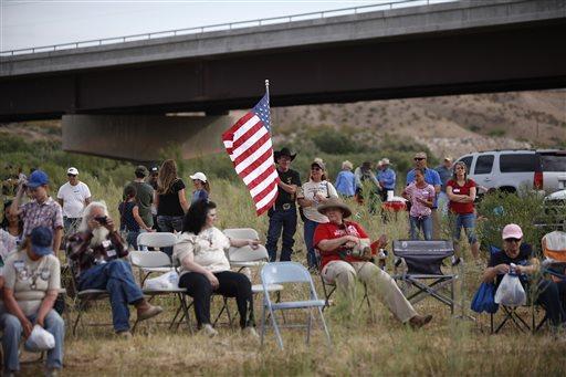 People gather along the Virgin River during a rally in support of Cliven Bundy near Bunkerville, Nev. Friday, April 18, 2014. (John Locher/Las Vegas Review-Journal)