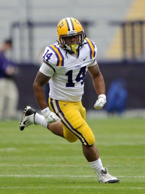 LSU senior runningback Terrence Magee (14) runs downfield Saturday, April 5, 2014 during the white squad's 42-14 victory against the purple squad in the National L Club Spring Game in Tiger Stadium.