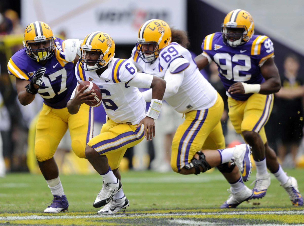 LSU freshman quarterback Brandon Harris (6) runs downfield Saturday, April 5, 2014 during the white squad's 42-14 victory against the purple squad in the National L Club Spring Game in Tiger Stadium.