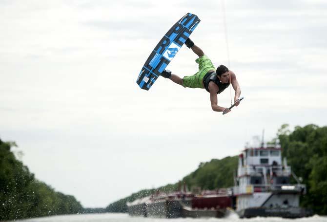 LSU wakeboarder Kyle Jordan does a trick Wednesday, April 30, 2014, in the Gulf Intracoastal Waterway.