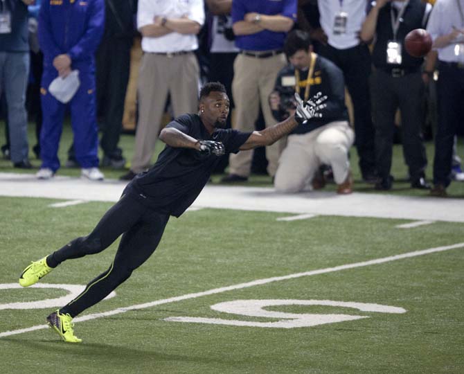 LSU junior wide receiver Jarvis Landry (80) attempts to catch a pass on Wednesday, April 9, 2014 during LSU Pro Day in the LSU Indoor Practice Facility.