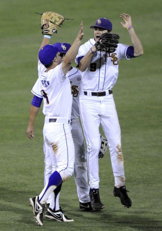 LSU sophomore infielder Alex Bregman (8) and LSU sophomore outfielder Mark Laird (9) celebrate the Tigers' 3-0 victory against Mississippi State on Friday, April 4, 2014 at Alex Box Stadium.