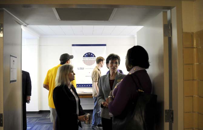 Patrons gather Friday, April 25, 2014, during the opening of the new Veteran Student Center in Hatcher Hall.