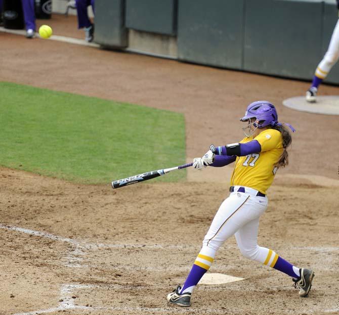 LSU sophomore catcher Kelsi Kloss (77) hits the ball Sunday, April 6, 2014, during the Tigers' 9-0 loss to Tennessee in Tiger Park.