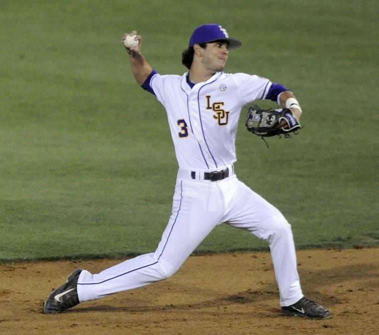 LSU freshman infielder Kramer Robertson (3) throws the ball during the Tigers' 3-0 victory against Mississippi State on Friday, April 4, 2014 at Alex Box Stadium.