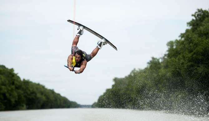 LSU wakeboarder Jordan Hughes flips on his wakeboard Wednesday, April 30, 2014, in the Gulf Intracoastal Waterway.