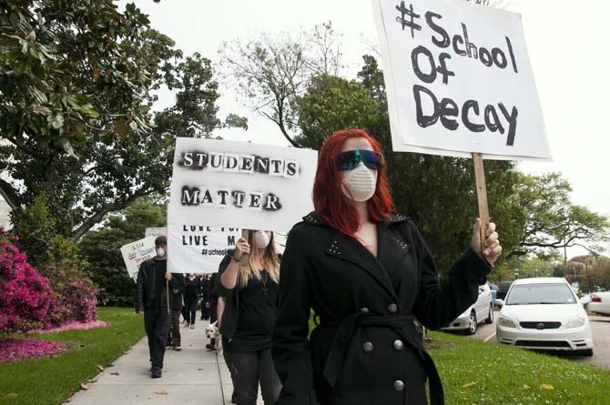 LSU School of Art &amp; Design students and supporters hold up signs in protest of the poor conditions in the Studio Arts Building on Tuesday, April 8, 2014, in front of the Louisiana State Capitol.