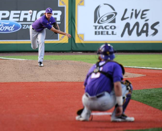 LSU junior pitcher Aaron Nola (10) warms up with junior catcher Tyler Moore (2) Saturday, May 31, 2014 before the Tigers' 5-1 victory against Houston in Alex Box Stadium.