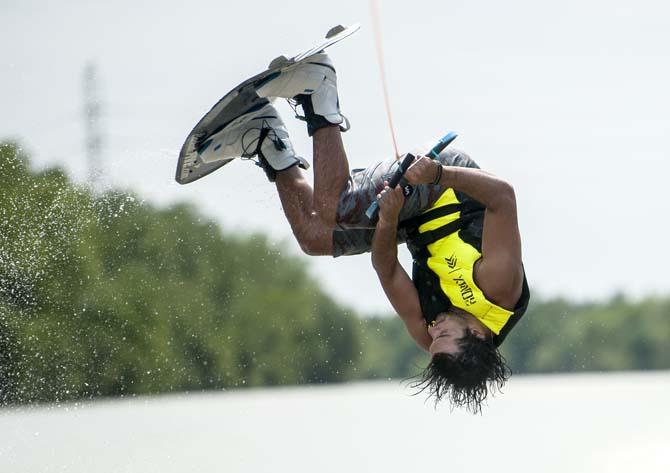 LSU wakeboarder Jordan Hughes flips on his wakeboard Wednesday, April 30, 2014, in the Gulf Intracoastal Waterway.