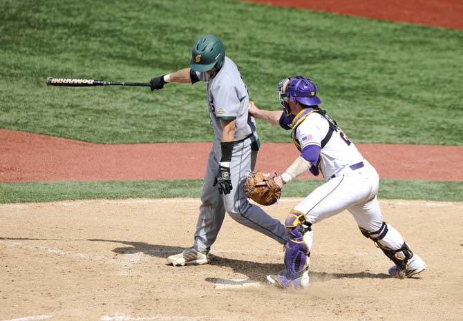 LSU junior catcher Kade Scivicque (22) tags out a Southeastern Louisiana batter at home plate Friday, May 30, 2014 during the Tigers' 8-4 victory against the Lions in Alex Box Stadium.