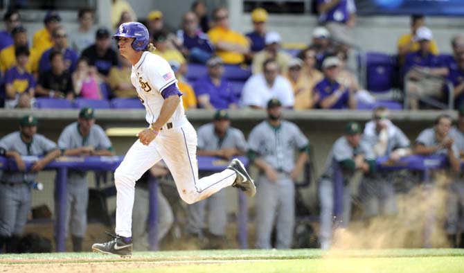 LSU sophomore outfielder Mark Laird (9) sprints toward home plate Friday, May 30, 2014 during the Tigers' 8-4 victory against Southeastern Louisiana in Alex Box Stadium.