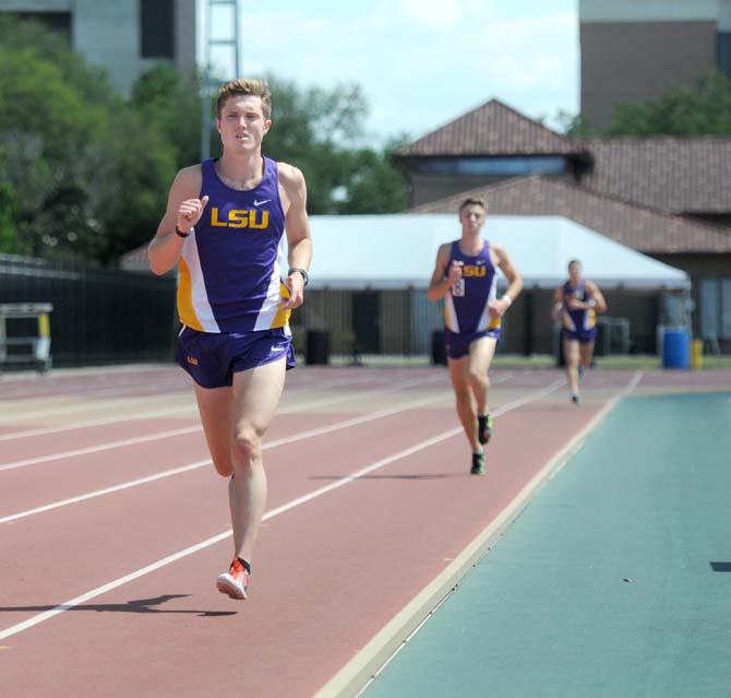 LSU freshman runner Kevin Kirchner (10) sophomore Aron Koenck (8) compete in the 5000 meter run Saturday, May 3, 2014 at the LSU Bernie Moore Track Stadium.