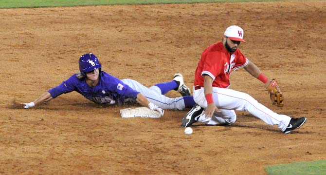 LSU sophomore outfielder Andrew Stevenson (6) slides into second base Saturday, May 31, 2014 during the Tigers' 5-1 victory against Houston in Alex Box Stadium.