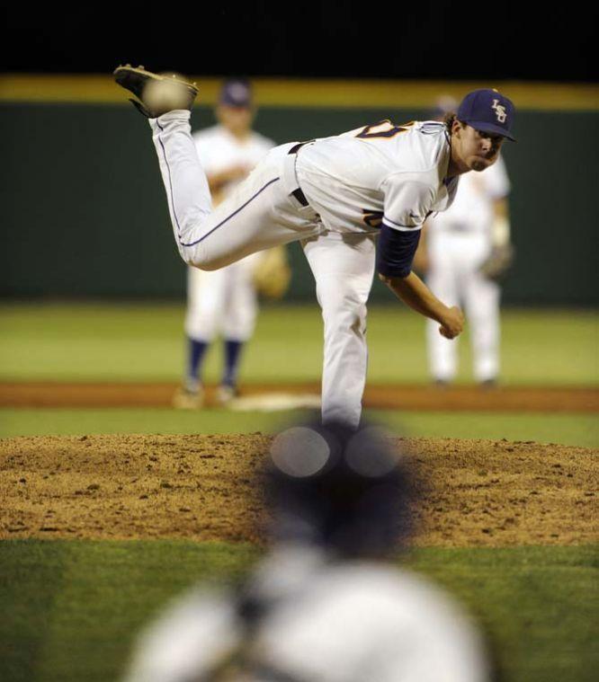 LSU junior pitcher Aaron Nola (10) warms up between innings Friday, April 25, 2014 during the Tigers' 8-7 victory against Tennessee at Alex Box Stadium.