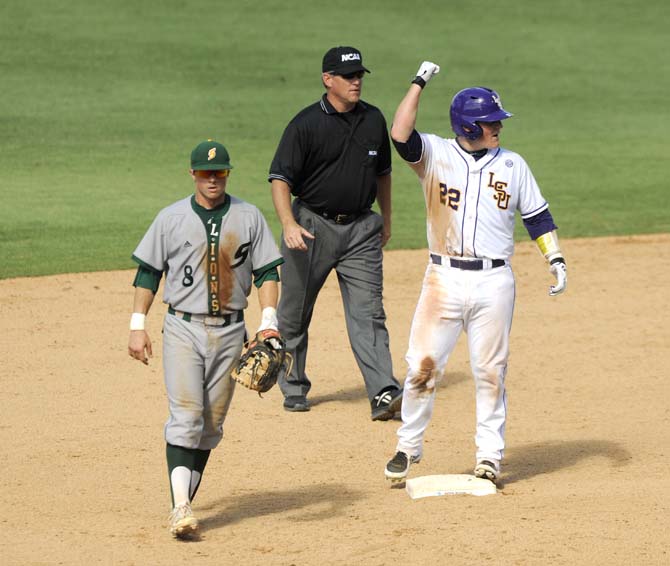 LSU junior catcher Kade Scivicque (22) celebrates after making it to second base Friday, May 30, 2014 during the Tigers' 8-4 victory against Southeastern Louisiana in Alex Box Stadium.