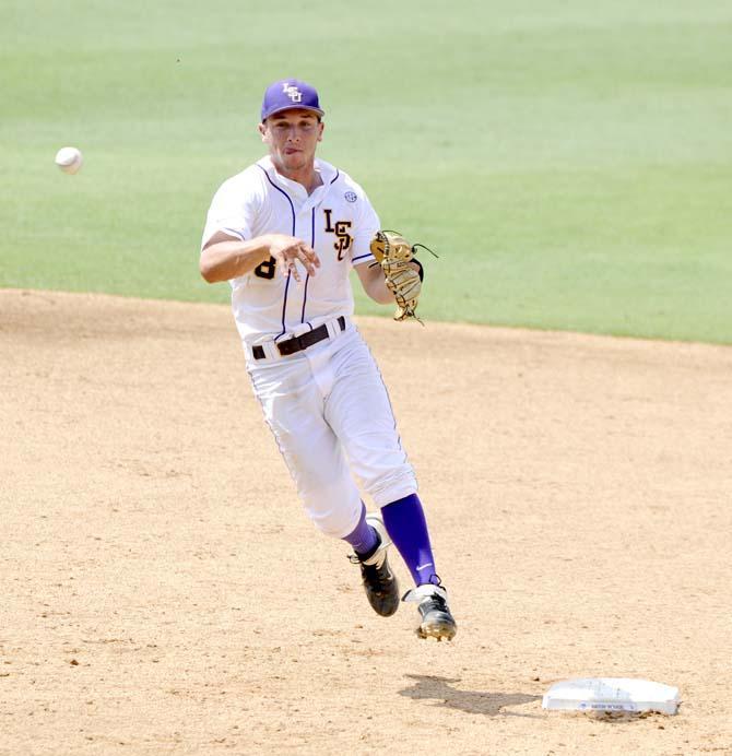 LSU sophomore infielder Alex Bregman (8) throws the ball toward first base Friday, May 30, 2014 during the Tigers' 8-4 victory against Southeastern Louisiana in Alex Box Stadium.