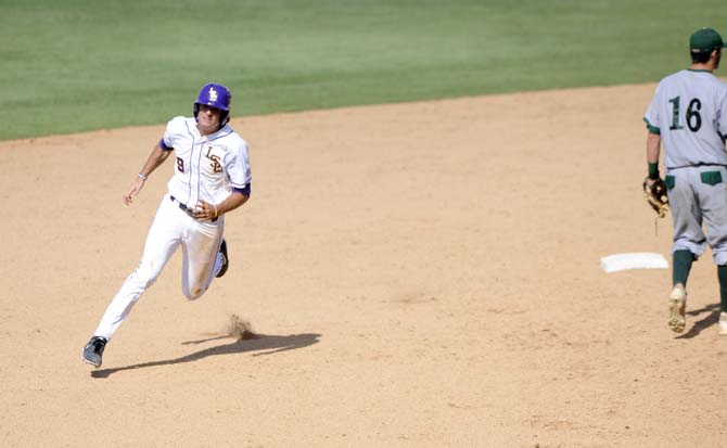 LSU sophomore outfielder Mark Laird (9) sprints past second base Friday, May 30, 2014 during the Tigers' 8-4 victory against Southeastern Louisiana in Alex Box Stadium.