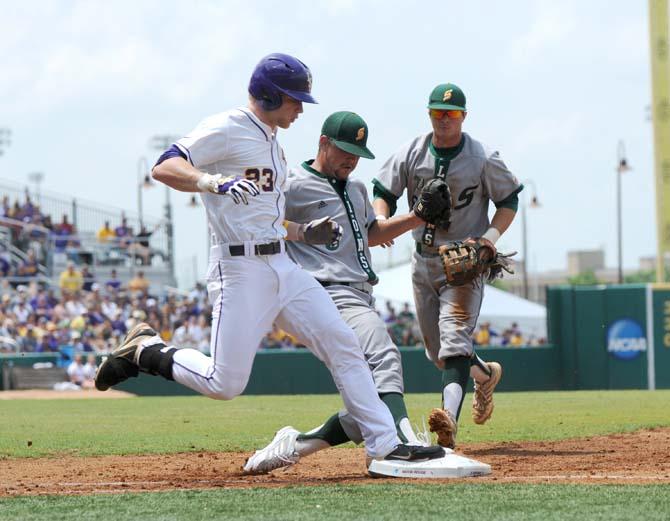 LSU freshman outfielder Jake Fraley (23) attempts to beat a Southeastern Louisiana player to first base Friday, May 30, 2014 during the Tigers' 8-4 victory against the Lions in Alex Box Stadium.