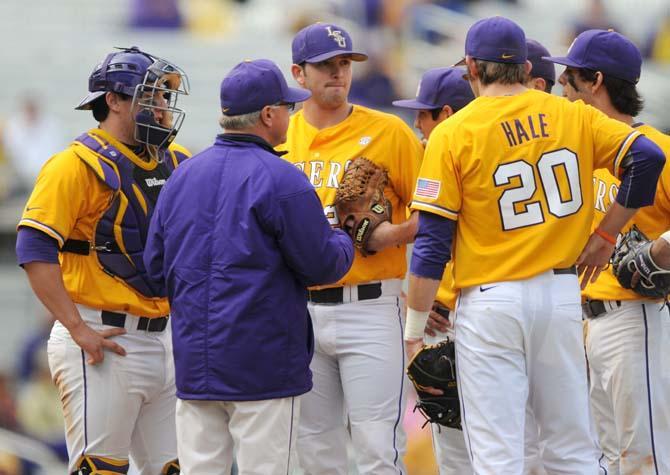 LSU head coach Paul Mainieri talks to the team on the mound Sunday, March 23, 2014 during the Tigers' 2-2 tie against Georgia at Alex Box Stadium.