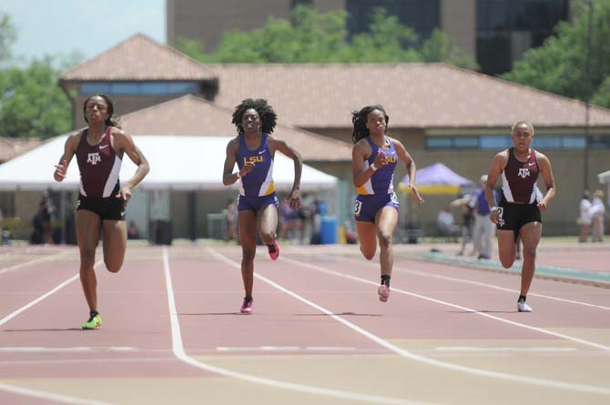 LSU freshman Rushell Harvey (3) and sophomore Kiersten Duncan (4) compete in teh 200 meter dash Saturday, May 3, 2014 at the LSU Bernie Moore Track Stadium.