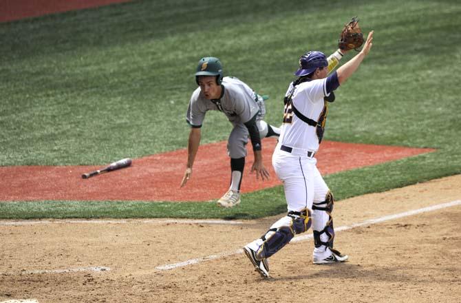 LSU junior catcher Kade Scivicque (22) calls to his teammates for the ball to be thrown to him at home plate Friday, May 30, 2014 during the Tigers' 8-4 victory against the Lions in Alex Box Stadium.