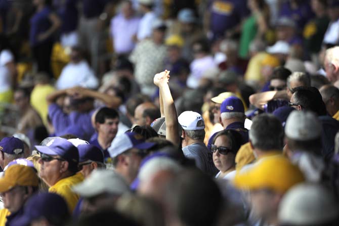 Fans participate in the seventh inning stretch Friday, May 30, 2014 during the Tigers' 8-4 victory against Southeastern Louisiana in Alex Box Stadium.