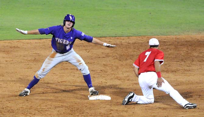 LSU sophomore outfielder Andrew Stevenson (6) indicates that he is "safe" Saturday, May 31, 2014 during the Tigers' 5-1 victory against Houston in Alex Box Stadium.