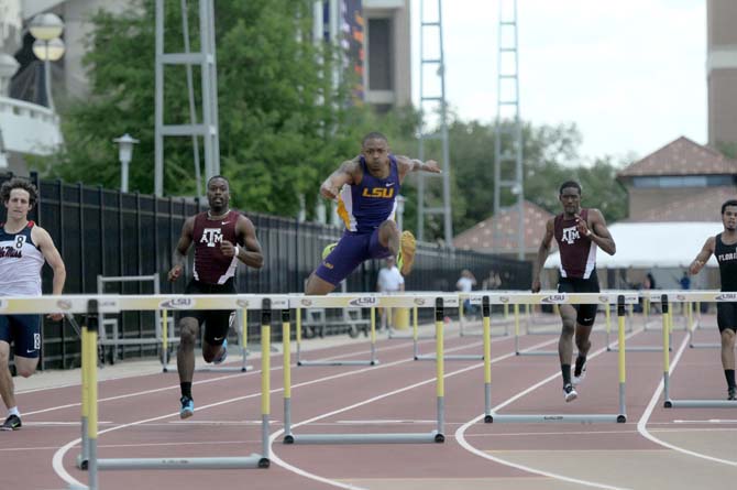 LSU junior Quincy Downing competes in the hurdle events Saturday, May 3, 2014 at the LSU Bernie Moore Track Stadium.