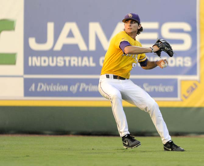 LSU sophomore outfielder Mark Laird (9) rears back to throw the ball toward home plate Monday, June 2, 2014 during the Tigers' 12-2 loss to Houston in Alex Box Stadium.