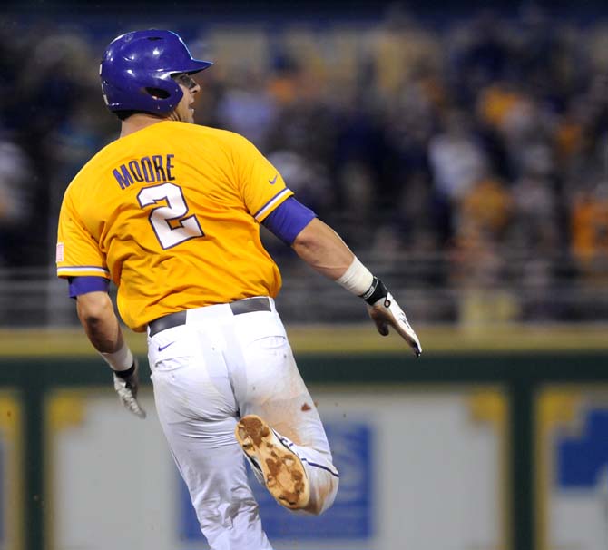 LSU junior infielder Tyler Moore (2) makes his way around the bases Sunday, June 1, 2014 during the Tigers' 5-4 loss against Houston in Alex Box Stadium.