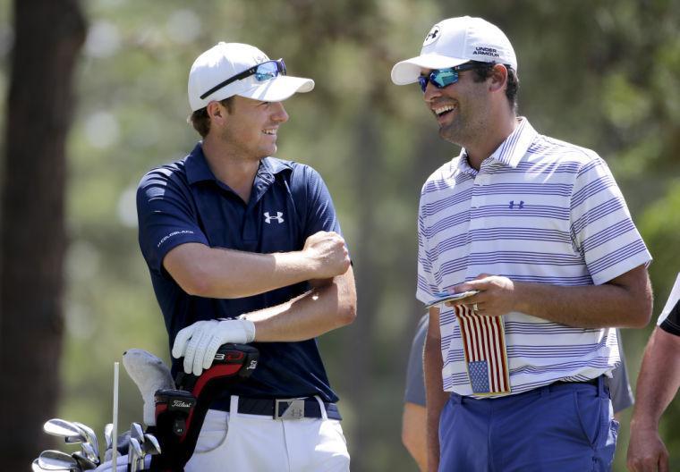 Jordan Spieth, left, and caddie Michael Greller talk on the 14th hole during a practice round for the U.S. Open golf tournament in Pinehurst, N.C., Tuesday, June 10, 2014. The tournament starts Thursday. (AP Photo/Chuck Burton)