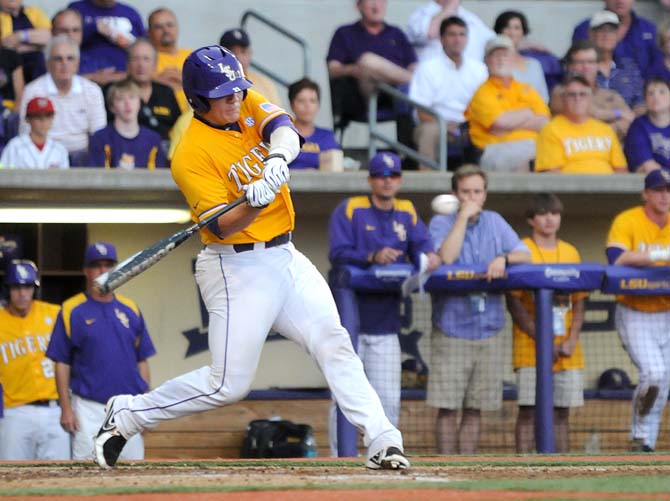 LSU junior catcher Kade Scivicque (22) swings at a pitch Monday, June 2, 2014 during the Tigers' 12-2 loss against Houston in Alex Box Stadium.