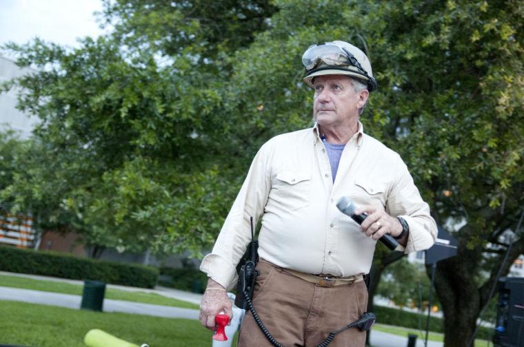 An actor surveys the developing theatrical elements near the starting line Saturday, June 28, 2014 before the post-apocalypse themed 5k race "Escape from Baton Rouge" near the Capitol building downtown.