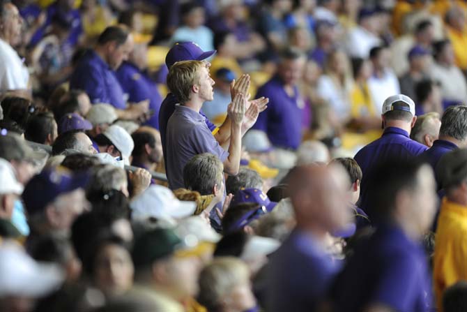 Fans stand up to cheer Saturday, May 31, 2014 during the Tigers' 5-1 victory against Houston in Alex Box Stadium.