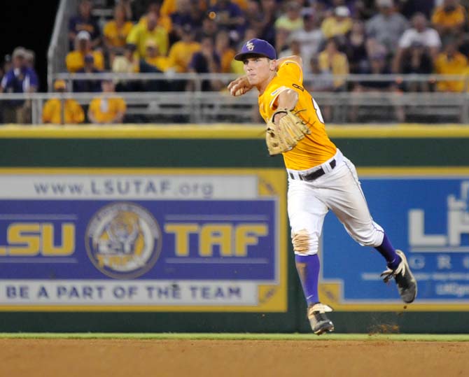 LSU sophomore infielder Alex Bregman (8) throws the ball toward first base Sunday, June 1, 2014 during the Tigers' 5-4 loss against Houston in Alex Box Stadium.