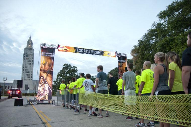 Race participants wait at the starting line Saturday, June 28, 2014 before the post-apocalypse themed 5k race "Escape from Baton Rouge" near the Capitol building downtown.