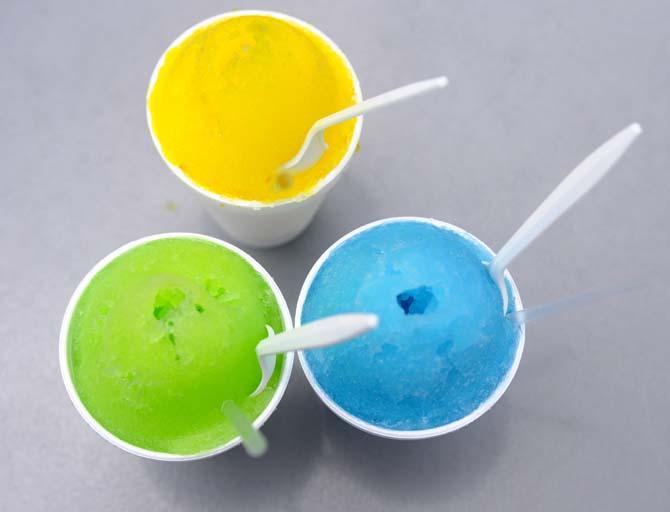 Snoman Snowballs' Ice Cream (top), Lemon-Lime (left) and Polar Punch (right) flavored snowballs Tuesday, April 17, 2014 on 9534 Burbank Dr.