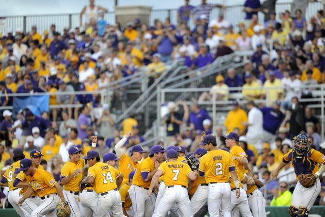 LSU team members break from their huddle before Tigers' 5-4 loss against Houston in Alex Box Stadium on Sunday, April 1, 2014.