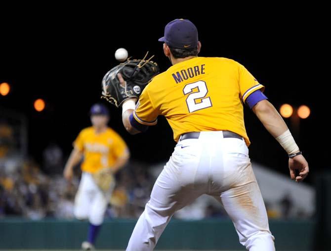 LSU junior infielder Tyler Moore (2) prepares to catch the ball at first base Sunday, June 1, 2014 during the Tigers' 5-4 loss against Houston in Alex Box Stadium.