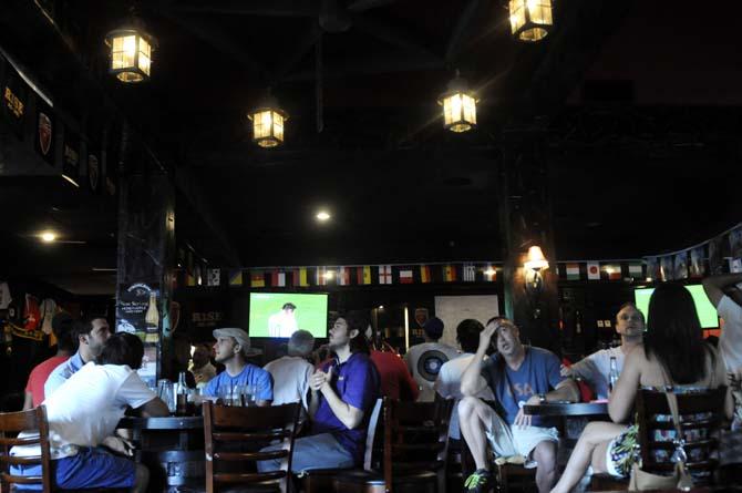 Fans watch nervously Saturday, April 14, 2014 during the England vs Italy FIFA World Cup game screening at The Londoner Grill.