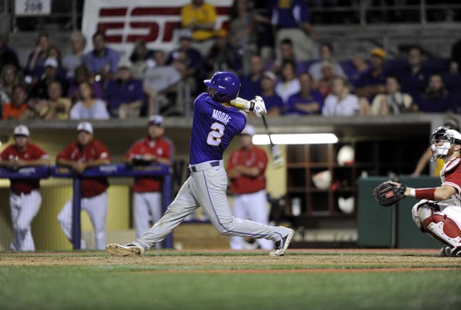 LSU junior infielder Tyler Moore (2) hits the ball Saturday, May 31, 2014 during the Tigers' 5-1 victory against Houston in Alex Box Stadium.