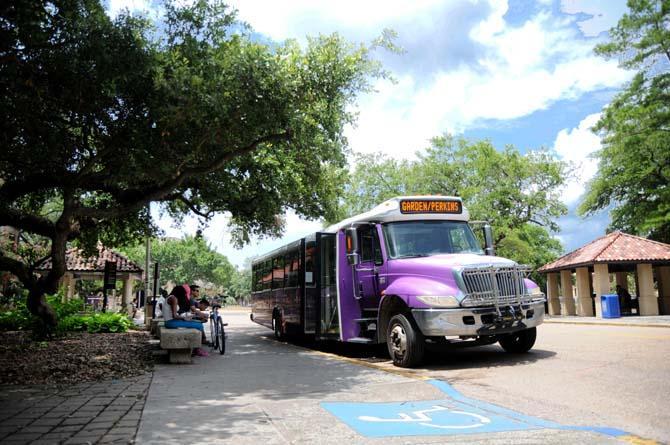 Students wait to board the bus Monday, June 16, 2014 outside of Hodges Hall.