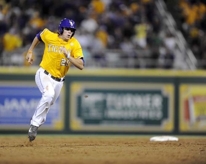 LSU junior infielder Conner Hale (20) rounds second base Sunday, April 1, 2014 during the Tigers' 5-4 loss against Houston in Alex Box Stadium.