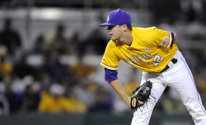 LSU sophomore pitcher Hunter Devall (12) looks intently at the catcher to coordinate on the next pitch Monday, June 2, 2014 during the Tigers' 12-2 loss against Houston in Alex Box Stadium.