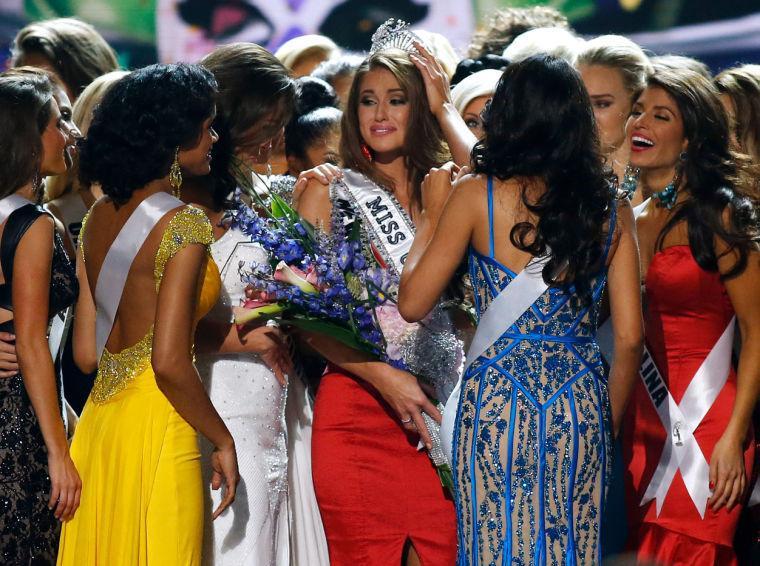 Miss Nevada USA Nia Sanchez celebrates with her competitors after being crowned Miss USA during the pageant in Baton Rouge, La., Sunday, June 8, 2014. (AP Photo/Jonathan Bachman)