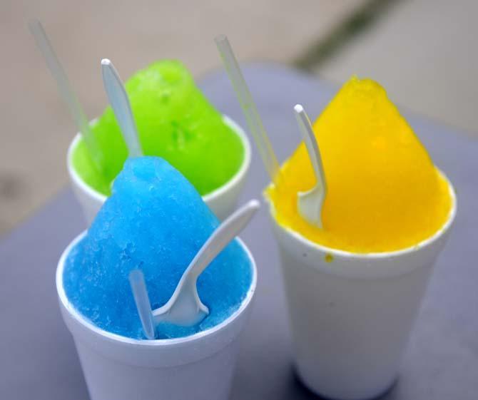 Snoman Snowballs' Ice Cream (right), Lemon-Lime (back) and Polar Punch (left) flavored snowballs Tuesday, April 17, 2014 on 9534 Burbank Dr.